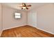 Bedroom featuring hardwood floors, one window and a sliding door closet at 7953 Forest Park Dr, Indianapolis, IN 46217