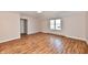 Bedroom with hardwood floors features a window that offers plenty of natural light at 7953 Forest Park Dr, Indianapolis, IN 46217
