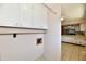 Laundry room featuring upper cabinets and easy access to the kitchen at 7953 Forest Park Dr, Indianapolis, IN 46217