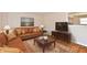 Staged living room featuring hardwood floors, neutral paint, and contemporary furnishings at 7953 Forest Park Dr, Indianapolis, IN 46217
