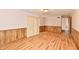 Large living room with wood-look floors and sliding glass doors for natural light at 7953 Forest Park Dr, Indianapolis, IN 46217