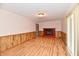 Cozy living room featuring wood floors, brick fireplace, and natural light at 7953 Forest Park Dr, Indianapolis, IN 46217