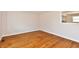 Empty room featuring hardwood floors and bright lighting at 7953 Forest Park Dr, Indianapolis, IN 46217