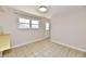 Bright room featuring tile flooring, a window, and a door at 7953 Forest Park Dr, Indianapolis, IN 46217