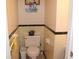 A half bathroom features tiled walls and a vintage-style toilet at 8137 S Delaware St, Indianapolis, IN 46227