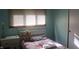 Cozy bedroom with a bright window, neutral walls, and hardwood flooring at 8137 S Delaware St, Indianapolis, IN 46227