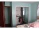 Cozy bedroom featuring an open closet and soothing blue walls and wood-look flooring at 8137 S Delaware St, Indianapolis, IN 46227