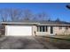 Ranch-style home with a large two-car garage and brick facade at 8137 S Delaware St, Indianapolis, IN 46227