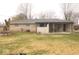 Exterior view of the home and the covered patio from the backyard at 8137 S Delaware St, Indianapolis, IN 46227