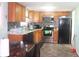 Well-equipped kitchen with stainless steel appliances, backsplash, and cozy dining area at 8137 S Delaware St, Indianapolis, IN 46227