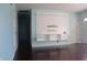Inviting living space with hardwood flooring, built in shelving, and natural light at 8137 S Delaware St, Indianapolis, IN 46227