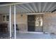 View of the covered patio, including furniture and access into the home at 8137 S Delaware St, Indianapolis, IN 46227