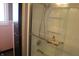 Updated bathroom with tiled walk-in shower and glass door at 8137 S Delaware St, Indianapolis, IN 46227