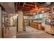 Basement with exposed ceiling, utility fixtures, and storage shelving at 8510 N Park Ave, Indianapolis, IN 46240