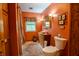 Vibrant bathroom with an antique vanity, vessel sink, beautiful accent rug, and natural lighting at 8510 N Park Ave, Indianapolis, IN 46240