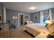 Inviting bedroom featuring soft carpet, a cozy loveseat, and a serene color palette for relaxation at 8510 N Park Ave, Indianapolis, IN 46240