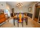 Traditional dining room featuring a unique chandelier, floral wallpaper, and a wooden dining set for elegant gatherings at 8510 N Park Ave, Indianapolis, IN 46240