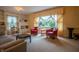 Bright living room featuring built-in shelving, large windows, and cozy seating, perfect for relaxing at 8510 N Park Ave, Indianapolis, IN 46240