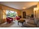 Cozy living room with a large window, comfortable seating, and warm lighting, creating an inviting space at 8510 N Park Ave, Indianapolis, IN 46240