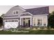 Charming single-story home with gray siding, covered porch, and attached garage at 9163 Bryce Cir, Zionsville, IN 46077