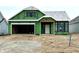 New construction home features an attached two car garage and a covered front porch at 9163 Bryce Cir, Zionsville, IN 46077
