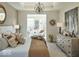 Spacious main bedroom with tray ceiling, large windows, and stylish furniture at 9163 Bryce Cir, Zionsville, IN 46077