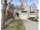 Charming townhouse with gray siding, attached garage, and well-maintained front yard at 9459 Wimbledon Ct, Indianapolis, IN 46250