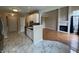 Open floor plan: kitchen seamlessly connects to living room with fireplace and loft at 9459 Wimbledon Ct, Indianapolis, IN 46250