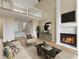 Open-concept living area with fireplace, loft, and comfortable seating at 9459 Wimbledon Ct, Indianapolis, IN 46250