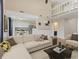 Cozy living room showcasing sofa and views of kitchen and loft at 9459 Wimbledon Ct, Indianapolis, IN 46250