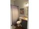 Well-lit bathroom featuring a clean, functional design with a toilet, sink, and coordinated decor at 950 Kempson Ct, Westfield, IN 46074