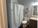 Cozy bathroom featuring a bathtub with shower, toilet, and storage baskets for toiletries at 950 Kempson Ct, Westfield, IN 46074