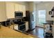 Well-lit kitchen features stainless steel appliances and granite countertops at 950 Kempson Ct, Westfield, IN 46074