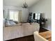 Cozy living room with a large sectional sofa, dark floors, and a decorative chandelier for comfortable living at 950 Kempson Ct, Westfield, IN 46074