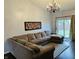 Spacious living room with a large sectional couch and access to the backyard at 950 Kempson Ct, Westfield, IN 46074