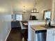 Open-concept living space with view of kitchen, dining area and hardwood flooring at 950 Kempson Ct, Westfield, IN 46074