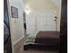 Bright bedroom featuring neutral walls, carpet flooring, and a comfortable bed with a cozy brown blanket at 9649 Cedar Cove Ln, Indianapolis, IN 46250