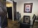 This modern dining room features a glass table, black chairs, and barn door entrance to the kitchen at 9649 Cedar Cove Ln, Indianapolis, IN 46250