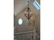 Bright entryway with decorative chandelier, modern art, and round window at 9649 Cedar Cove Ln, Indianapolis, IN 46250