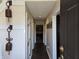 View of the home's entry hallway, displaying hardwood floors and neutral wall paint at 9649 Cedar Cove Ln, Indianapolis, IN 46250