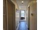 Well-lit hallway offers a glimpse of the home's layout and design, featuring neutral tones and a clean aesthetic at 9649 Cedar Cove Ln, Indianapolis, IN 46250
