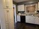 Well-organized kitchen with white cabinets, granite counters, and stainless steel appliances at 9649 Cedar Cove Ln, Indianapolis, IN 46250