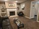 Inviting living room with a fireplace, built-in shelves, and plush seating at 9649 Cedar Cove Ln, Indianapolis, IN 46250
