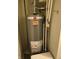 Rheem water heater in utility area, showcasing essential plumbing and providing efficient hot water supply at 9649 Cedar Cove Ln, Indianapolis, IN 46250