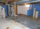 Basement with concrete floor and equipment, ready for storage or customization at 10966 W State Road 142, Quincy, IN 47456