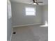 Bedroom with carpet flooring, ceiling fan, neutral walls and a large window providing natural light at 10966 W State Road 142, Quincy, IN 47456