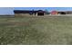 The exterior of the home features a well-manicured front lawn, complemented by a red barn at 10966 W State Road 142, Quincy, IN 47456