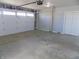 Clean garage with automatic door and side entry for easy access to storage at 10966 W State Road 142, Quincy, IN 47456