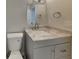 Modern bathroom features a vanity with a marble countertop, and a new toilet with white walls at 11144 Echo Trl, Indianapolis, IN 46236