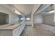 Primary bathroom featuring double sinks, a soaking tub, and access to the spacious bedroom at 11144 Echo Trl, Indianapolis, IN 46236